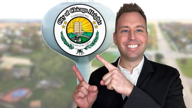 chicago heights illinois realtor tony anczer pointing to the chicago heights illinois water tower and the water tower has the Chicago Heights logo