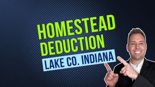 HD1 text of "Homestead Deduction Lake Co. Indiana" with real estate agent Tony Anczer pointing to the text. The backround is blue, "homestead deduction" is in lime green, "Lake Co. Indiana" is in blue. Tony Anczer is wearing a suit