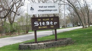 village of steger illinois roadside sign with text "the village of Steger welcomes you"