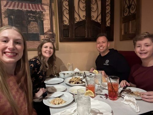 Northwest Indiana realtor Tony Anczer and his family of 4 eating dinner at a booth Little Italy restaurant in Dyer IN