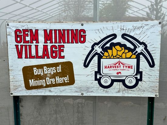"gem mining village" sign at Harvest Tyme family farm fall festival