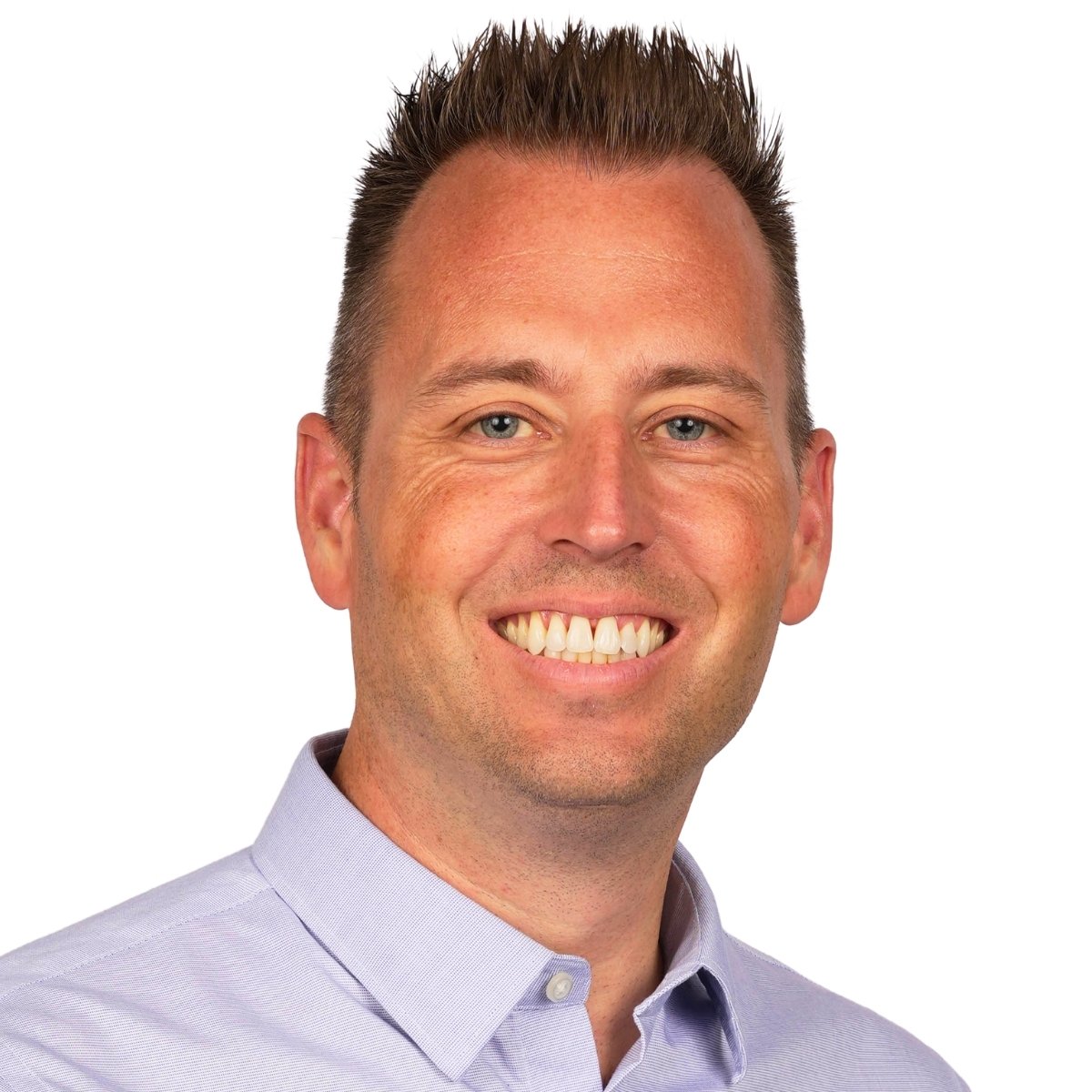 Headshot of Dyer Indiana Realtor Tony Anczer. The photo is from the botton of neck collar to just higher than top of hair. Tony is wearing a blue button-up shirt and there is a white background