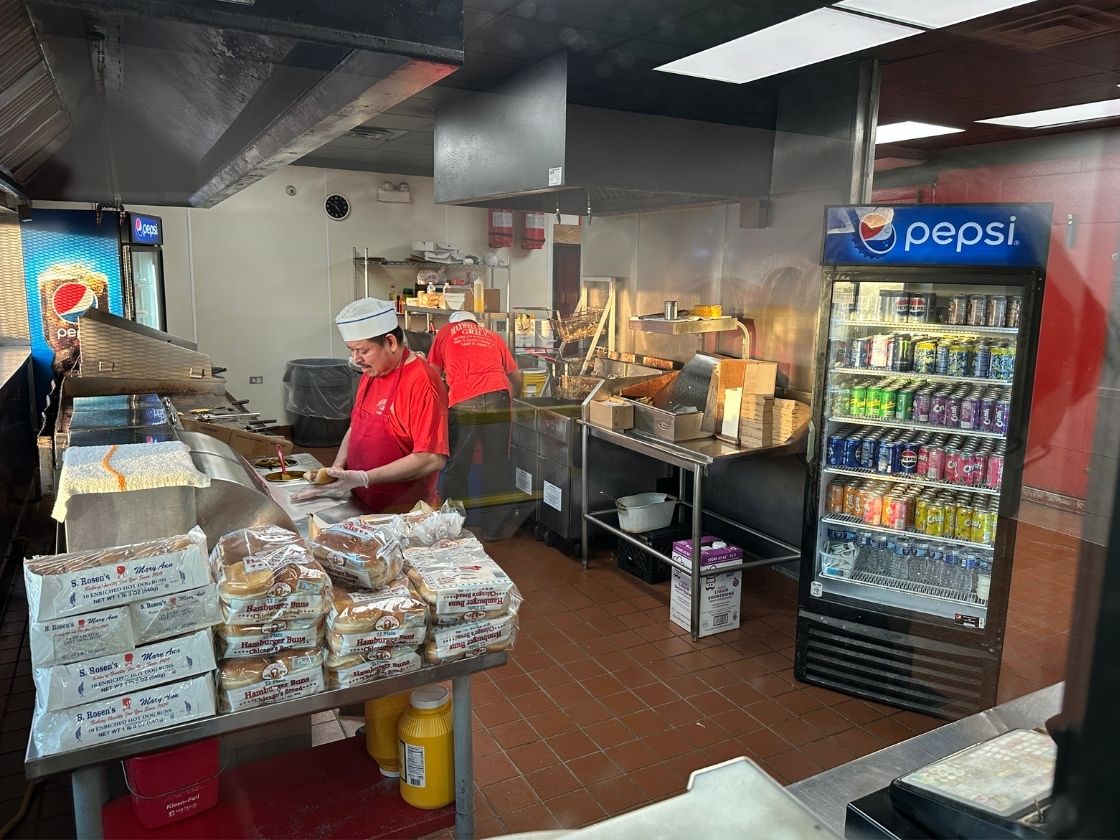 view of kitchen and chefs preparing food at maxwell street polish in chicago illinois